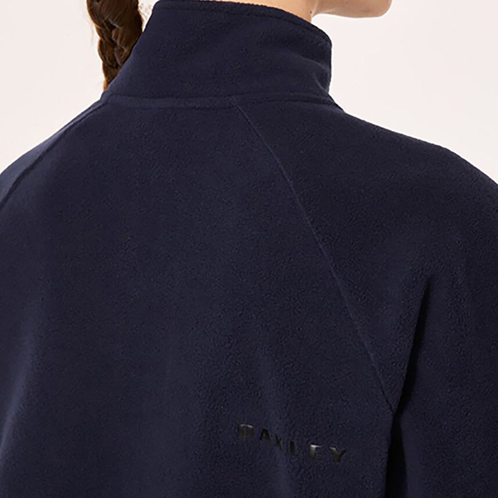 En Fleece, Ridge ½ Zip i farven Fathom set bagfra