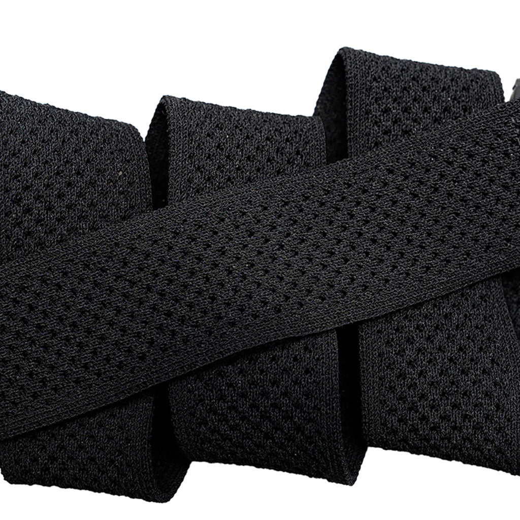 Et bælte, Momentum i farven sort nærbillede af materiale