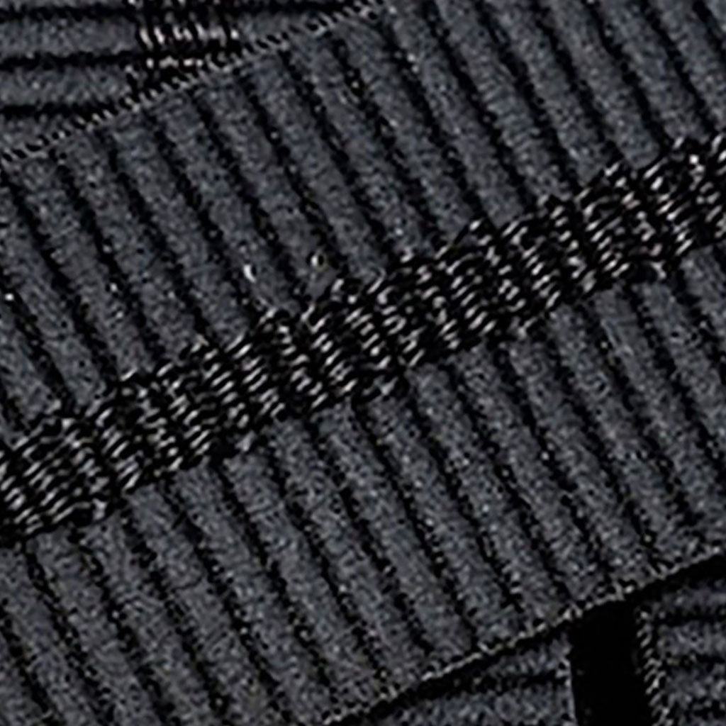 Et bælte, Stamped i farven sort nærbillede af materiale